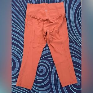 Athleta women's Salutation Stash Pocket Tight size S orange